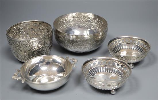 A Persian white metal bowl, a Victorian silver sugar bowl, pair of small silver nut dishes and a small silver bowl, gross 7.5 oz.